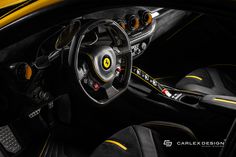 the interior of a yellow and black sports car