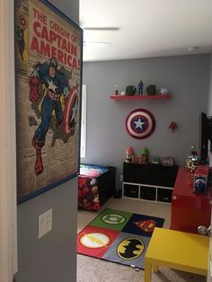 the interior of a child's room decorated with captain america posters and rugs