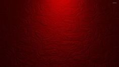 a red wall with a light on it