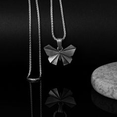 This necklace is a unique design made of oxidized 925 silver by hand. This necklace features a lovely origami butterfly pendant that is made of high-quality oxide silver metal. The pendant has a delicate design that captures the beauty and grace of the winged creatures. The necklace comes with a matching silver chain that is adjustable in length. This necklace is a wonderful gift for anyone who loves butterflies, origami, or elegant style. It is also a symbol of transformation, freedom, and joy. Unique Silver Butterfly Necklace For Gift, Butterflies Origami, Paper Folding Art, Origami Necklace, Winged Creatures, Geometric Origami, Art Chinois, Book Necklace, Origami Butterfly