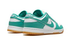 The Women’s Nike Dunk Low “Teal Zeal” is a women’s-exclusive colorway of the vintage basketball and lifestyle shoe that was released in July 2022.  A summer-ready colorway, the “Teal Zeal” features an appealing combination of white leather on its base, and Teal Zeal-colored leather on its overlays and Swoosh branding.  A white “Nike” logo is embroidered on the heel.  An orange tongue tag with “Nike Dunk” branding contrasts the look of the white tongue.  Teal Zeal laces continue the shoe’s bold s Womens Dunk Low, White Tongue, Nike Embroidery, Vintage Basketball, July 2022, Stadium Goods, White Turquoise, Nike Womens, White Nike