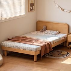 a bedroom with a single bed and wooden floors