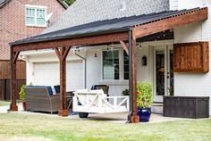 a house with a covered patio and outdoor furniture