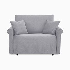 a gray couch with two pillows on it