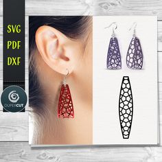 the earrings are designed to look like they have been cut out from different shapes and sizes