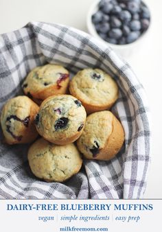 blueberry muffins in a basket on a table