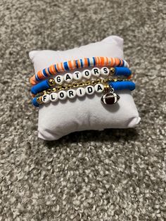 Support your Florida gators by purchasing this four  layered stacked stretchy bracelet Handmade myself from purchased parts. Show your favorite team spirit/ support.  Go Gators Go Gators Football, Florida Gators Bracelet, Florida Gator Jewelry, Chomp Chomp, Uf Gators, Florida Gators Baseball, Football Jewelry, Florida Gators Football, Gators Football