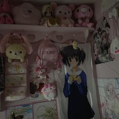 a room filled with lots of stuffed animals and other stuff items on the wall above