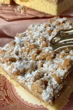 two pieces of cake on a plate with a fork