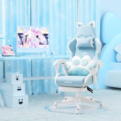 a child's room with blue walls and white furniture, including a teddy bear chair