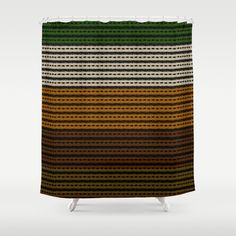 a shower curtain with an orange, green and black striped pattern on it's side