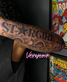 a man with a tattoo on his arm that reads stargirl and has an eagle