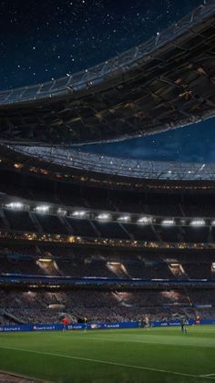 an empty soccer stadium at night with the lights on