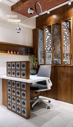 an office with speakers on the desk