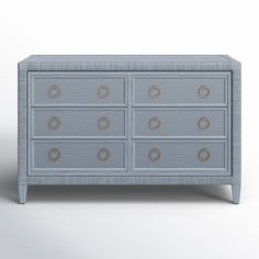 an image of a blue dresser with gold circles on the top and bottom drawer drawers