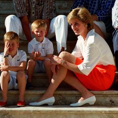 the princess and her children are sitting on steps