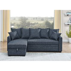 a blue sectional sofa with storage underneath it