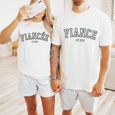 Are you looking for a ENGAGEMENT T SHIRT? We got you! ✅ ABOUT OUR FIANCEE Comfort Colors Tee  ▸ 100% ring-spun US cotton for long-lasting comfort.  ▸  The garment is sewn around the finished edges with double stitching, making it long-lasting ▸  The garment is dyed after it's been constructed, giving it a soft color and texture ▸ Printed and shipped from the USA ✅ HOW TO ORDER   1. Check our photos for sizing and color options. 📏 2. Choose your quantity. Feel free to add as many shirts as you wish! ✨ 3. Select your size and color from the drop-down menus. ✨ 4. Click "ADD TO CART" to add the shirt to your virtual cart. 🛒 5. Click "PROCEED TO CHECKOUT" to purchase your shirt. 🛒 6. Your shirt is now off to production! We will process your order and your shirt will be ready for shipment in Ways To Announce Engagement, Fiance Shirts, Fiancee Shirt, Custom Engagement Gifts, Engagement Shirt, Engaged Shirts, Cricket Ideas, Couple Engagement Pictures, Photo Care