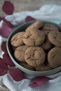 a bowl filled with cookies sitting on top of a table