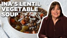 a woman sitting in front of a bowl of lentil and vegetable soup with the words ina's lentil vegetable soup