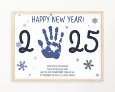 a happy new year's card with a hand print and snowflakes on it