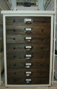 a drawer with many drawers and labels on it