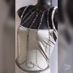 Go Out In Style With This New Harness Necklace, That You Won't See Anywhere Else. All Eyes Will Be On You!! This Necklace Starts At The Neck With Twelve Rows Of Small Gunmetal Curb Chain Going From The Top To The Bottom Of The Neck Connecting To A Beautiful Clasp, From There Four Rows Of Rolo Gunmetal Chains Come Down The Front To The Hips To Connect To The Belt Of Gunmetal And Silver Chains. This Harness Can Be Worn Two Ways, Depending On Your Style For The Day! Chain Body Jewelry, Handmade Silver Body Jewelry, Silver Chain Body Jewelry As Gift, Silver Necklace With Chain Strap As Gift, Adjustable Silver Metal Body Jewelry, Silver Body Chain With Chain Strap As Gift, Metal Body Chain Gift, Silver Clavicle Chain Body Chain As Gift, Silver Jewelry With Chain Strap As Gift