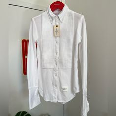 This Listing Is For A Brand New Thom Browne Tuxedo Shirt . Fll043a-00050 100 Classic Long Sleeve Point Collar Button Down Shirt Wi French Cuff & Pleated Bib In Cotton Pique Size 38 Women Brand New With Tags. Women’s Tuxedo Shirt, French Cuff, Tuxedo Shirts, Thom Browne, Women Brands, Colorful Shirts, Button Down Shirt, Cuff, Womens Tops