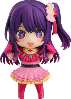 a doll with purple hair and blue eyes wearing a pink dress, holding her hands up