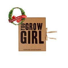 a brown box with a red ribbon around it and the words grow girl on it