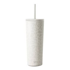 a white cup with a straw sticking out of it's side, on a white background