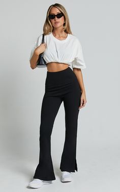 Step up your style game with our Beau Pants. These high-waisted, full-length skinny leg pants are the perfect addition to your casual wardrobe. Made from a comfortable and lightweight rayon fabric, these black pants will effortlessly elevate any outfit. The split hem adds a trendy touch while allowing for easy movement. Whether you're heading to brunch or a night out with friends, these versatile Beau Pants have got you covered. Embrace your individuality and show off your fierce fashion sense i High-waisted Elastane Pants For Loungewear, High Stretch Black Pants, Versatile Elastane Ankle-length Yoga Pants, Versatile Ankle-length Elastane Yoga Pants, Casual High Stretch Straight Pants, Versatile High Waist Leggings For Night Out, High-waisted Elastane Athleisure Pants, Chic Straight Yoga Pants With Elastic Waistband, Chic Black Straight Leg Yoga Pants