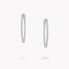 From the Classic Graff collection, our diamond large hoop earrings in white gold are a twist on a timeless design. Cradled within a minimal white gold setting, each diamond radiates natural fire and exceptional brilliance. The Classic Graff collection features the finest Graff diamonds showcased in sleek, stylish silhouettes that you will wear time and time again. Available in a variety of different carat sizes. An elegant pair of Classic Graff round diamond hoop earrings with a total approximat Graff Engagement Ring, Graff Jewelry, Diamond Shaped Engagement Ring, White Diamond Jewelry, Graff Diamonds, Diamond Earrings Studs Round, Fine Diamond Jewelry, Engagement Ring Shapes, Platinum Jewelry