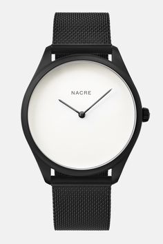 A minimal, modernist watch with a soft white, pearlized dial. Paired with a matte black mesh band. Minimalist Watch Women, Watch Minimalist, Minimal Watch, Minimalist Watch, Watch Women, Saddle Leather, Telling Time, Navy Leather, Soft White