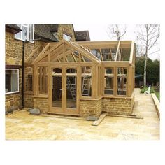 a house being built with wooden framing and windows