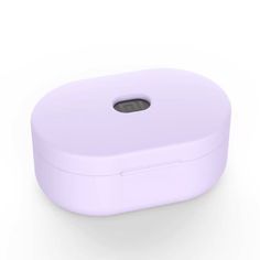 an electronic device is shown on a white surface with a light purple cover and black buttons