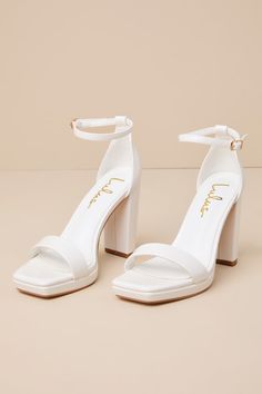 The Lulus Signie White Square-Toe Platform Ankle Strap Heels will be your favorite way to elevate any special occasion look all year long! Smooth faux leather shapes these trendy heels that feature a square toe bed (atop a 0.5"" toe platform) and a wide toe strap. A sturdy heel cup supports a slender ankle strap that secures with a shiny gold buckle, all atop a classic block heel. 4" wrapped block heel. Lightly cushioned insole. Rubber sole has nonskid markings. Man made materials. Imported. Lul White Shoes For Wedding Brides, Homecoming Heels Chunky, Cute Heels White, Comfortable High Heel Shoes For Women, Wedding Day Heels, Pretty Heels Prom, Elegant Shoes For Women, Wedding Shoes With Pearls, White Hoco Heels