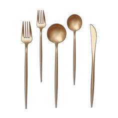 gold colored utensils and spoons on a white background