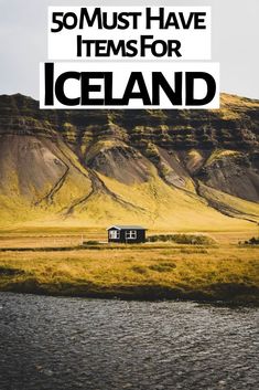 a small house sitting on top of a lush green hillside next to a river with the words somust have items for iceland