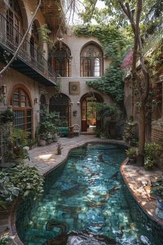 an indoor swimming pool in the middle of a courtyard