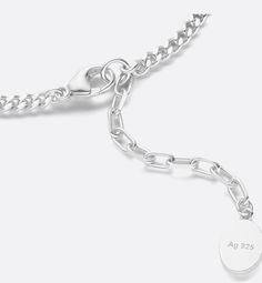 The silver necklace showcases a modern and resolutely Dior style. The thin chain links are enhanced by openwork CD Icon signatures, paying homage to House archives. An adjustable clasp adorned with a Dior signature allows the necklace to be worn at different lengths. The necklace can be coordinated with the matching bracelet to complete the look.. Cd Icon, Dior Style, Chain Link Necklace Silver, Dior Star, Icon Shoes, Christian Dior Couture, Matching Bracelet, Silver Cufflinks, Total Look