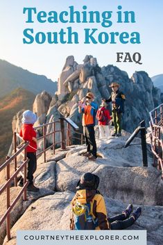 people standing on top of a mountain with the words teaching in south korea faq