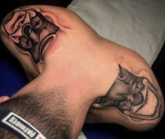 a man with a tattoo on his arm laying down