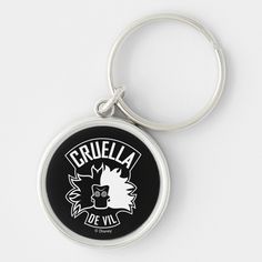 a black and white key chain with the words cruella do vil on it