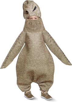 a child in a costume that looks like a creature