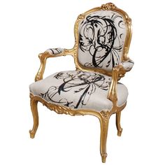 an ornate chair with black and white designs on it