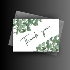 a thank card with green leaves on it