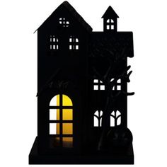 a black silhouette of a house with windows and a clock tower on it's side