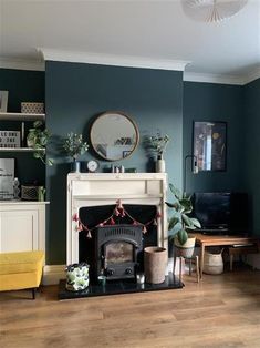 a living room filled with furniture and a fire place