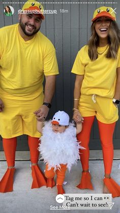 two people dressed in yellow and orange standing next to each other